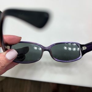Kate Spade sunglasses. Black exterior frame and purple interior frame.